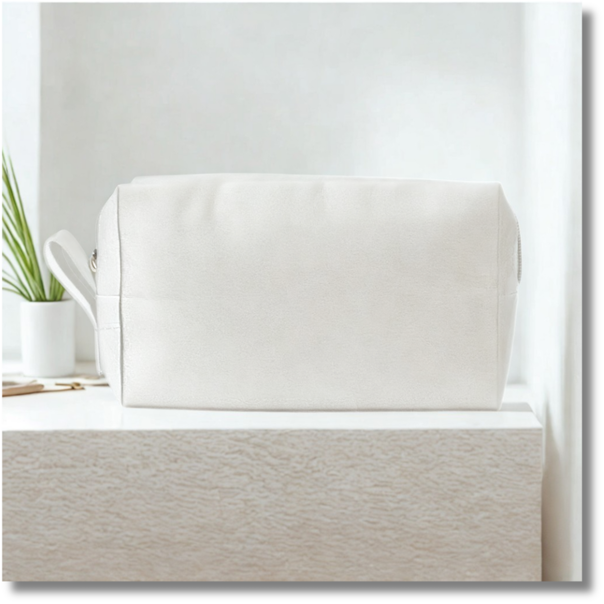 White travel pouch on a slab with a minimal background