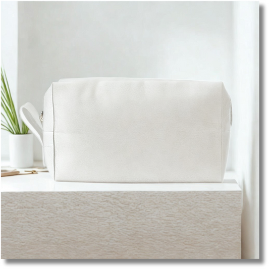White travel pouch on a slab with a minimal background